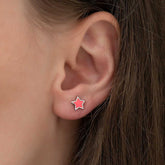 Boucles d'oreilles étoile rose fluorescente argentée